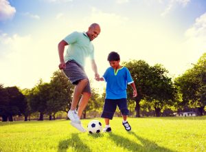 Father Son Playing Soccer Park Summer Concept