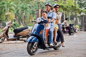 The perfect vietnamese family riding its motorbike in HCMC